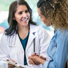 Doctor with patient reviewing results